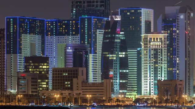 Doha skyscrapers in downtown skyline night timelapse, Qatar, Middle East