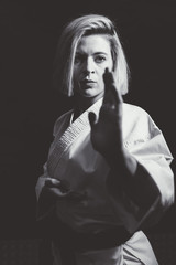 Woman who is exercised practicing karate © karrastock