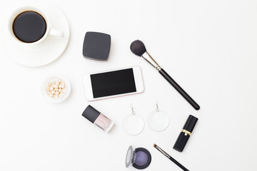 Female cosmetics and accessories on a white background. Minimalism flat lay