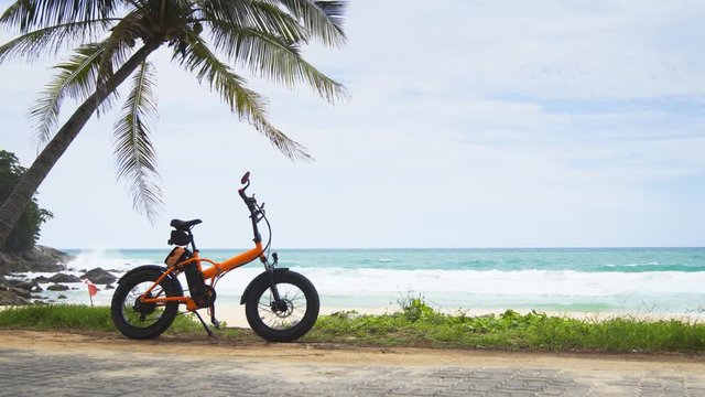 Electric Bicycle Parked at a Tropical Beach in Phuket