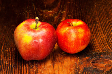Red apple on wooden background