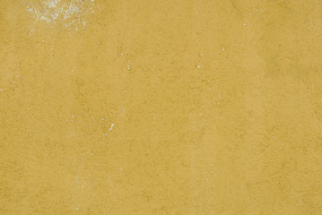 Background: wall of cabin, mountain cottage, colorful, yellow, painted concrete, ruined, architecture, Italy