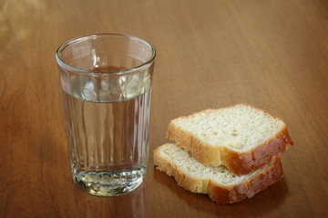 Full glass of water and two slices of bread