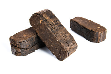 Peat briquettes isolated on white background, alternative fuels