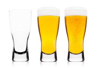 Cold glasses of lager ale beer with foam