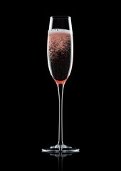 Rose pink champagne glass with bubbles on black