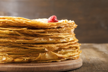 Many thin pancakes on the table