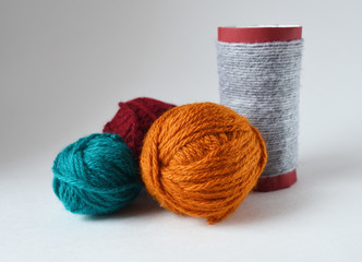 yarn and glass on a white background