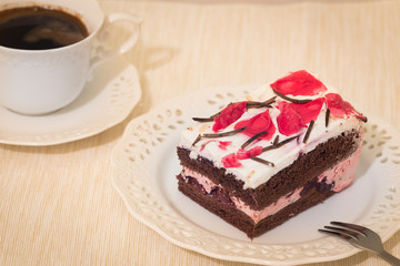 a delicious piece of cake with a cup of coffee.