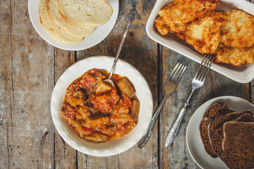 salad of eggplant and tomato serving on the table - a meal with Meat deep-fried and
