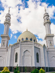 Beautiful White Mosque at the Sunny Day with Clouds.