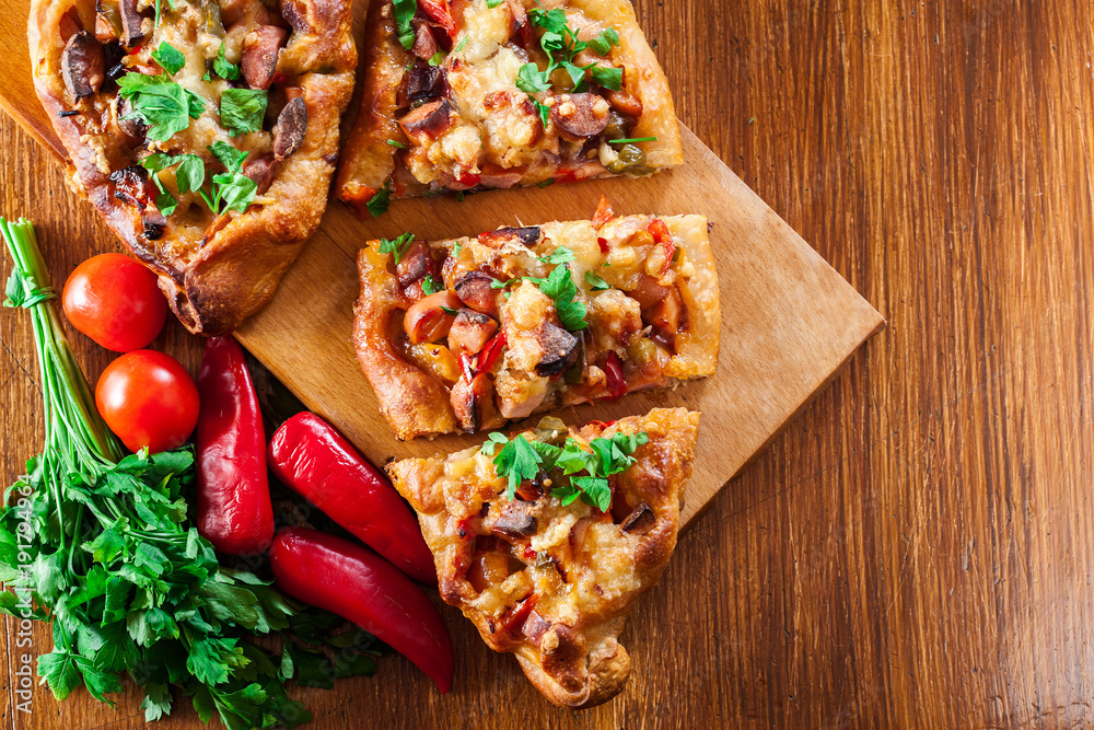 Wall mural Sliced traditional Turkish pide with meat and vegetables