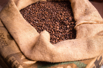 A burlap bag with coffee beans inside