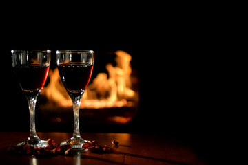 Romantic scene with wine Glasses and Fireplace