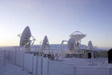 Satellite antenna against sunset
