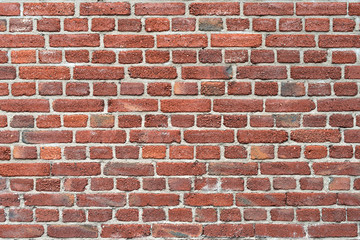 Old red brick wall as background or texture