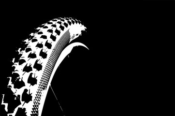 Cover the bicycle wheel. Moto concept on a black background. Graphical representation of the contour of a bicycle wheel