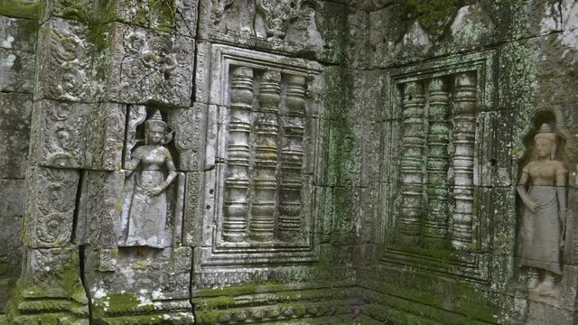 pan of carved stone devata and balustrades at ta nei temple near angkor wat, cambodia