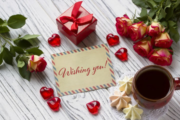 Valentines day greeting card with roses red gift box and lettering.