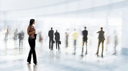 abstrakt image of people in the lobby of a modern business center with a blurred background