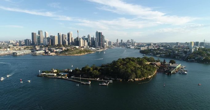 Goat island in the middle of Sydney Harbour aerial flying towards Barangaroo, the Rocks and city CBD.
