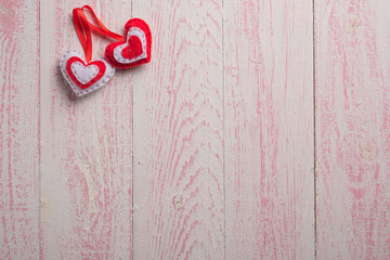 red heart on a pink wooden texture