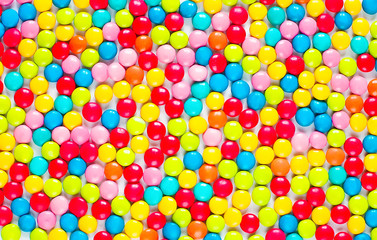 Fototapeta na wymiar Background of multicolored sweet candy dragees