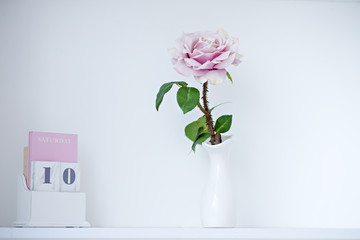 Elements of the interior of the children's room in pastel colors. Flowers, toys, candles, calendars, mirrors