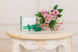 wedding rings with box and flowers
