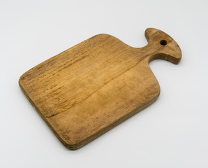 Wooden chopping board with handle isolated on white