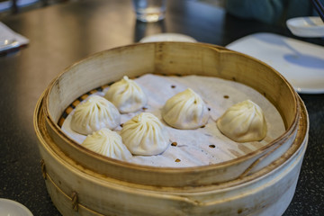 Soup dumplings steamed in bamboo steaming baskets