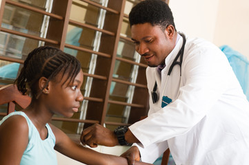 Fototapeta premium doctor is treating a patient in her office at the hospital.
