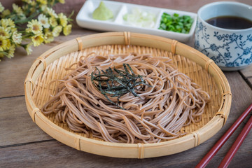 Soba noodles with dried seaweed on bamboo plate, Japanese food