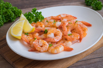 Fried shrimp with lemon on plate