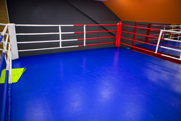 boxing gym in fitness center. Training boxing hall. Punching bag. Boxing ring. Empty boxing hall