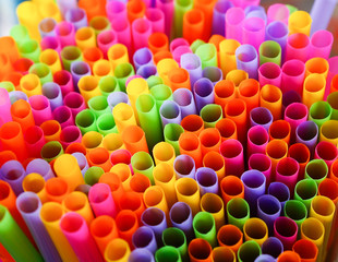 Colorful fancy drinking straws background. Selective focus