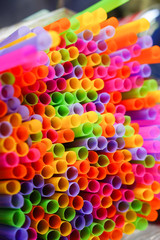 Colorful fancy drinking straws background. Selective focus
