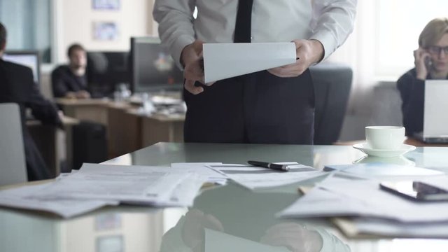 Chief looking plans for office per month and preparing tasks for co-workers