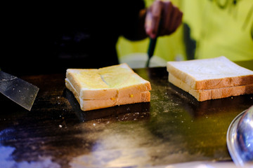 Butter toast cooking on hot pan