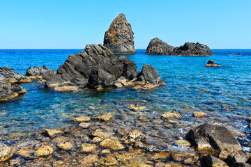 Fototapeta na wymiar Aci Trezza Faraglioni, Sicily coast