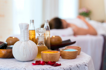 Rolled, compress balls, bottle oil, salt, towels, bowl, stone and candlelight. Treatment therapy spa thai and cleaning body. concept of beauty salon spa.