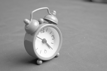 Alarm clock close-up in shades of gray.