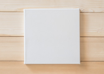 White blank canvas mockup square size on wood wall for arts painting and photo hanging interior...