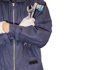 Car repairman wearing a dark blue uniform standing and holding a wrench that is an essential tool for a mechanic isolated on white background.