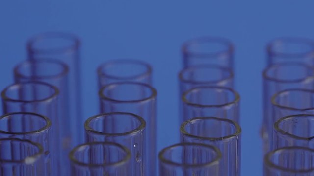 aboratory scientist working with a pipette analyzes and extract the DNA or molecules in the test tubes.on white background