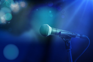 Close-up of microphone in concert hall or conference room,graphic design background.Mixed media