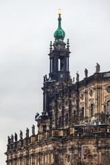 Fototapeta na wymiar Old City, Dresden. An ancient clock tower of the Royal Palace. Ancient architecture of Germany
