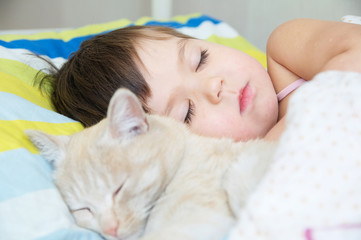 Little girl sleep with cat, favorite pet lying on child chest, Interactions between children and Cats