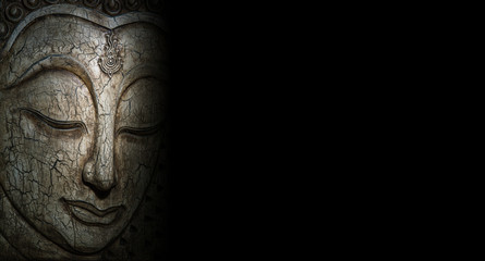 Fototapeta na wymiar Buddha faces carved out of wood