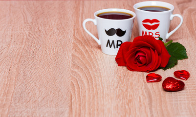 Valentines Day background with two coffee cups, hearts and rose flower